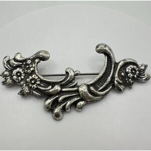 Vintage silver tone Art Nouveau Revival embossed scrollwork floral brooch